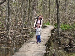 Jacob Wheeler; Katherine (Kat) McDougal Wheeler McCandless; Ellery Wheeler; in the woods at FLCC