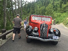 Red bus; Going to the Sun Road; West Glacier National Park, MT