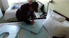 Norm Overbay; Graduation Dinner; preparing the Blue Foam toilet seats for Road Scholar Staff