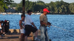 people fishing from the pier at Canandaigua Lake
