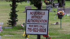 IAT
sign No Burials Without Authorization