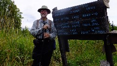 Dan Dorrough; 
sign Official End of the Superior Hiking Trail
Otter Lake Road
Swamp River 1 mi
Border Route Trail 2 mi
Prout Lake 1 7 mi
Jackson Lake Rd 2 0 mi