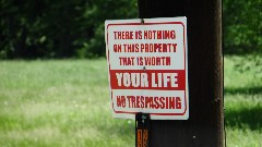 sign There is nothing on this property that is worth your life; No Trespassing; BT