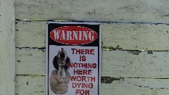 sign Warning There is nothing here worth dying for; BT