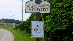 sign Welcome to Historic Milford; Trail Town; Proud to be part of the North Country National Scenic Trail; BT