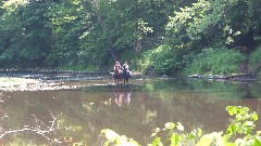 horses and riders in stream; Beaver Creek State Park