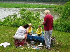 couple of artists painting statues near their home along the Allegheny River Trail