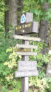 sign North Country Trail; Wampum- New Galilee Road; Road Walk 0 1 mile; Edwards Rd; Possum Hollow Road 5 mi; PA Game Comission; Game Land 148