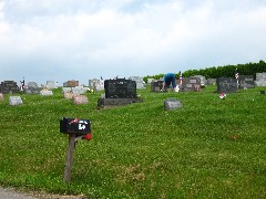 Cemetary being prepared for Memorial day; Pennsylvania